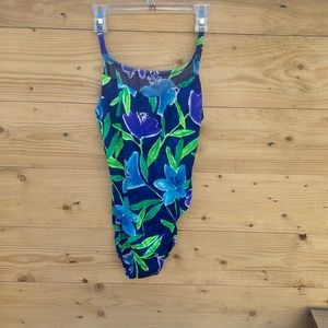 One piece size medium blue & green floral print bathing suit.
